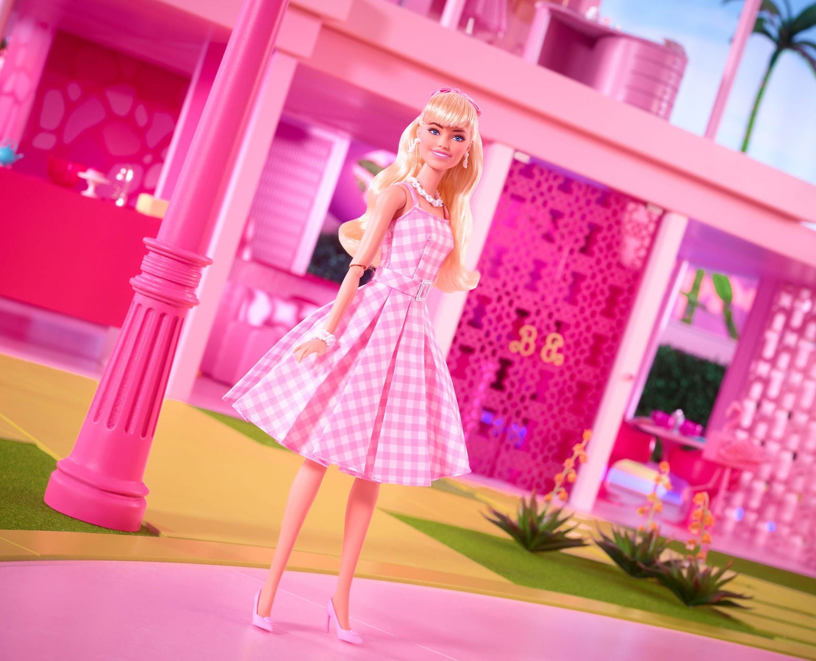 Margot Robbie as Barbie in a Charming Pink Gingham Dress from Barbie The Movie