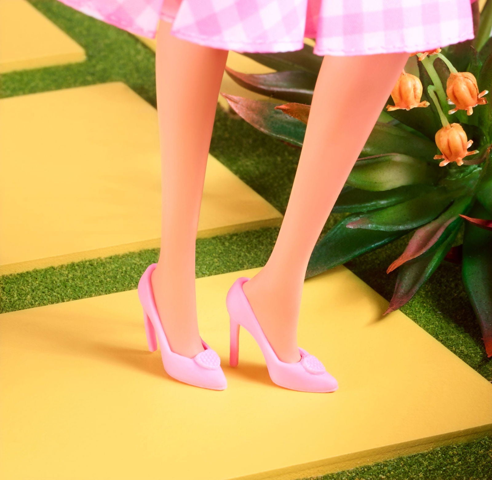 Margot Robbie as Barbie in a Charming Pink Gingham Dress from Barbie The Movie