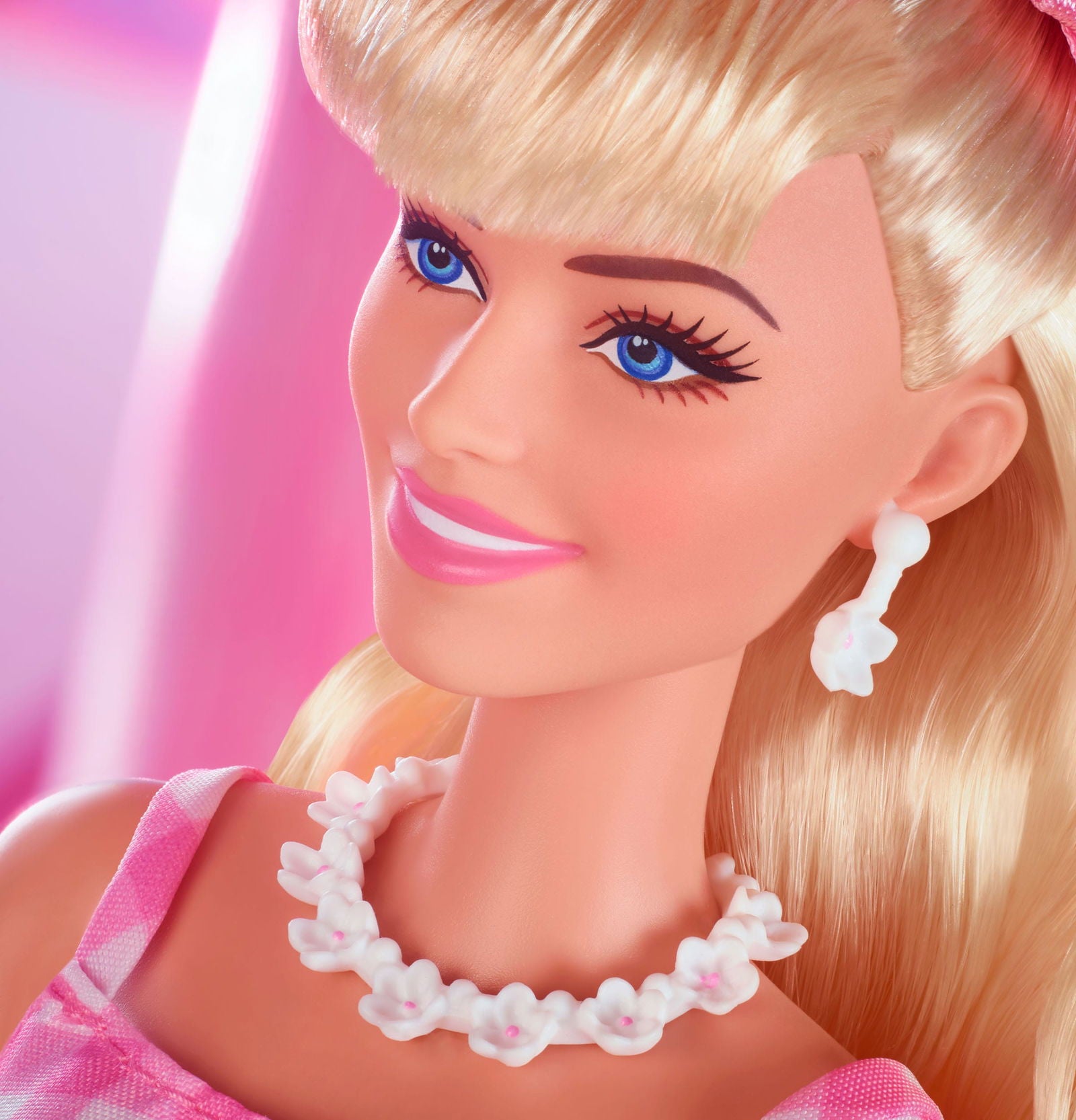 Margot Robbie as Barbie in a Charming Pink Gingham Dress from Barbie The Movie