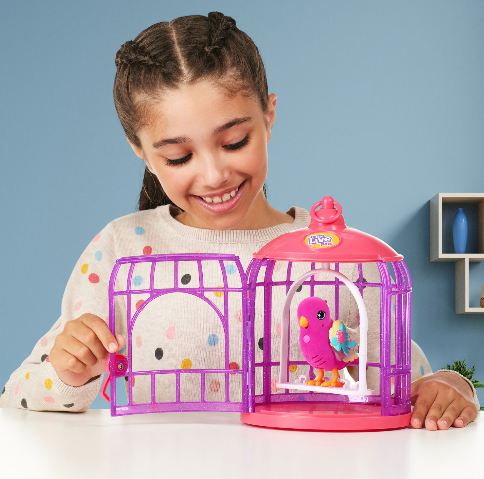 Little Live Pets Interactive Lil' Bird Toy with Magical Light - Up Wings and a Cute Bird Cage, Named Polly Pearl